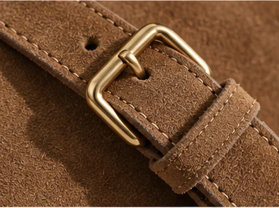 Close-up of the suede strap and gold buckle