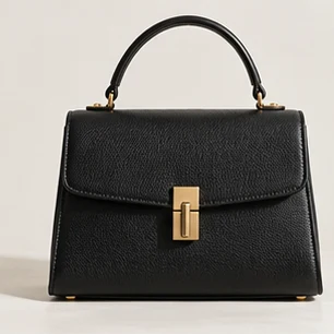 Structured black leather handbag with a gold clasp