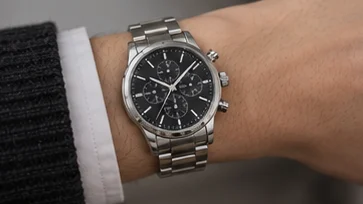 Steel chronograph worn, wrist side profile