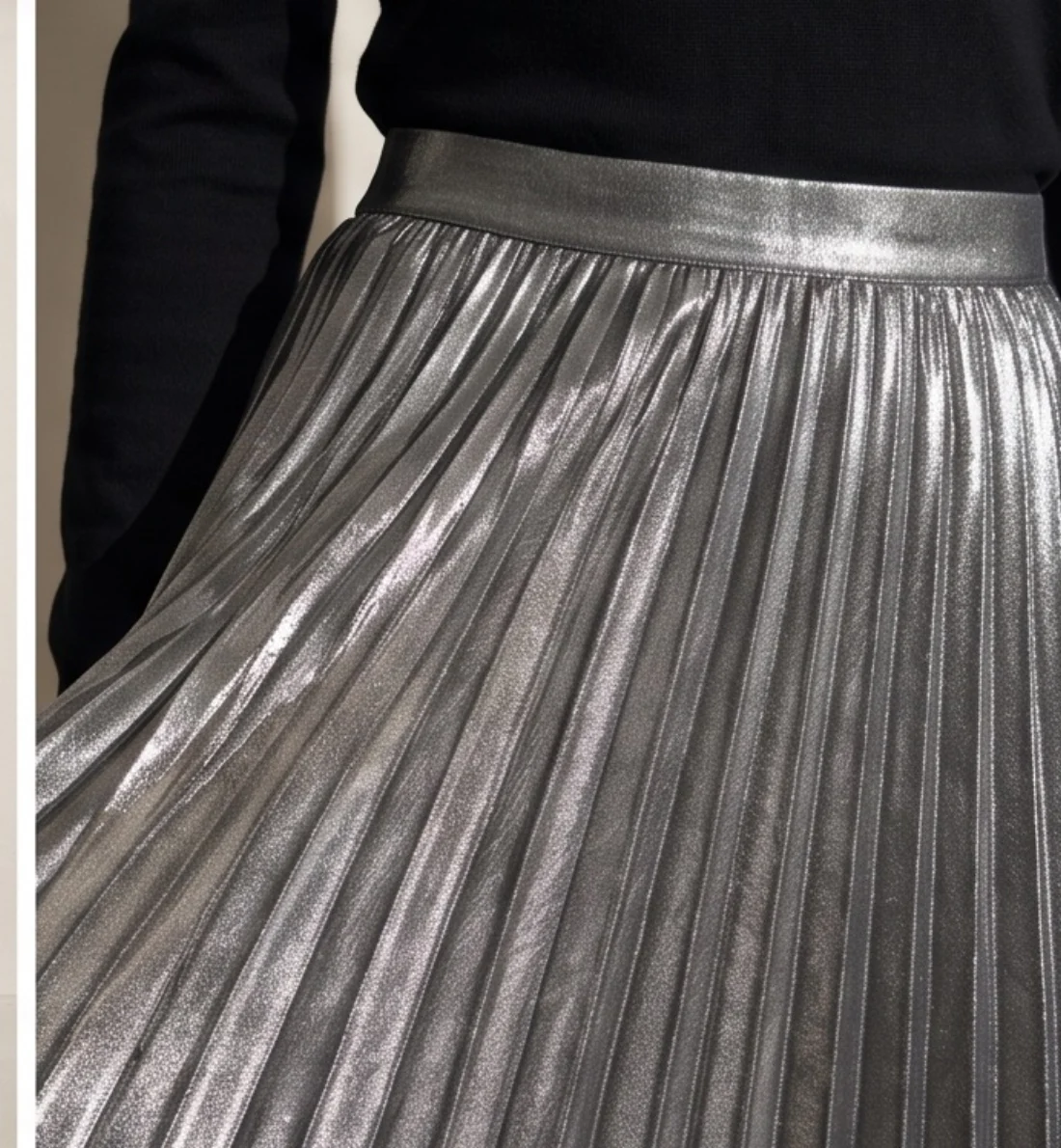 Metallic pleated skirt, print and logo close-up