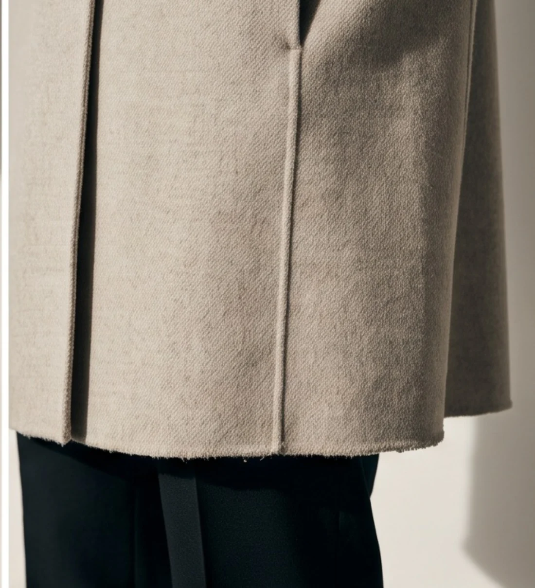 Stone wool coat, print and logo close-up